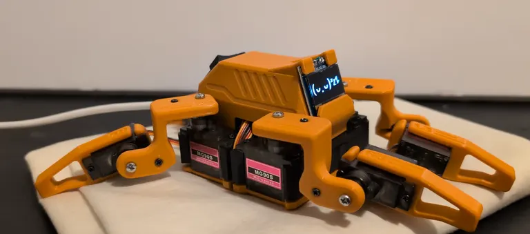 Sesame, a small orange 3D printed walking robot